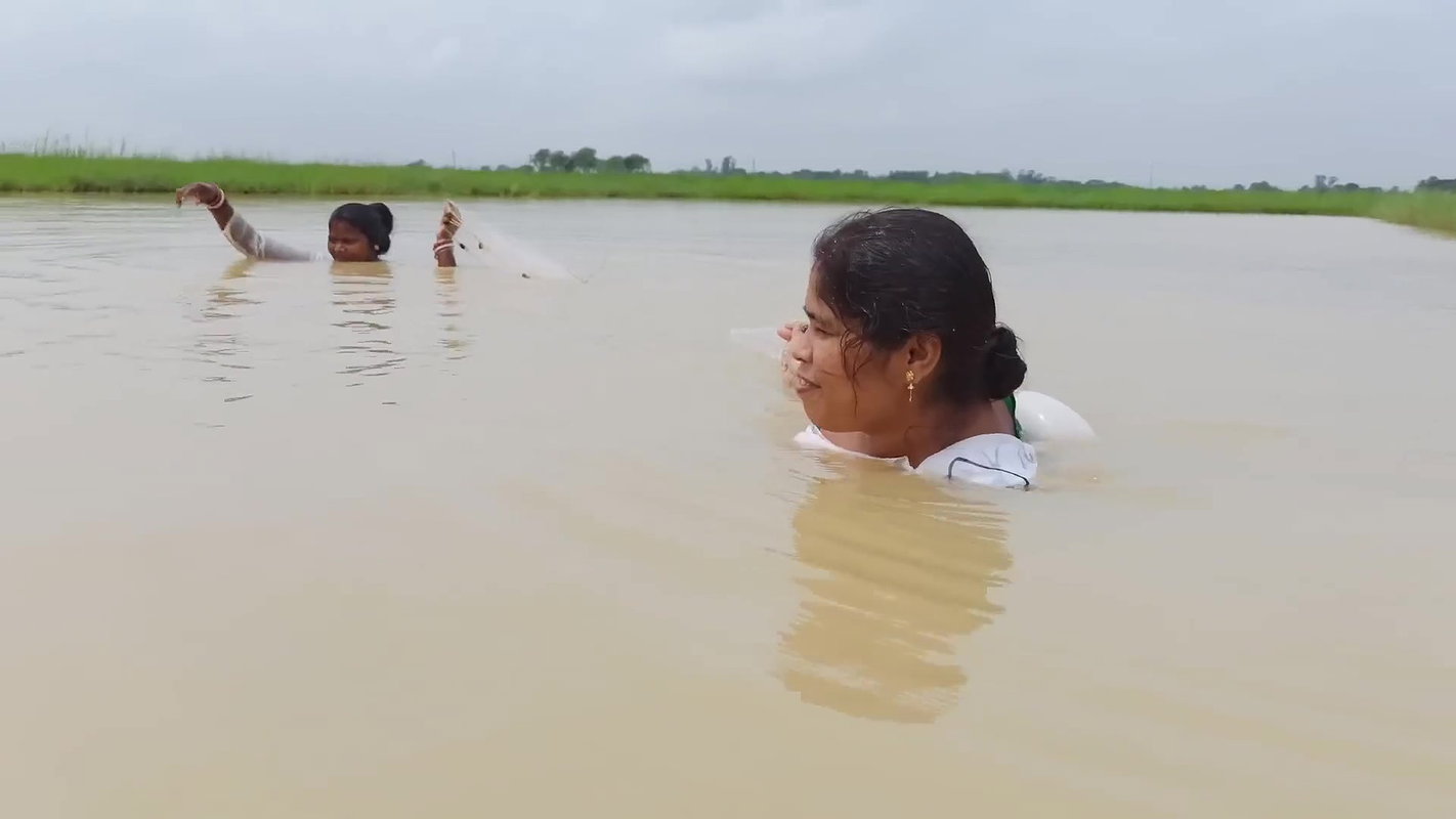 Amazing Two Village Women Catching Fish with Net