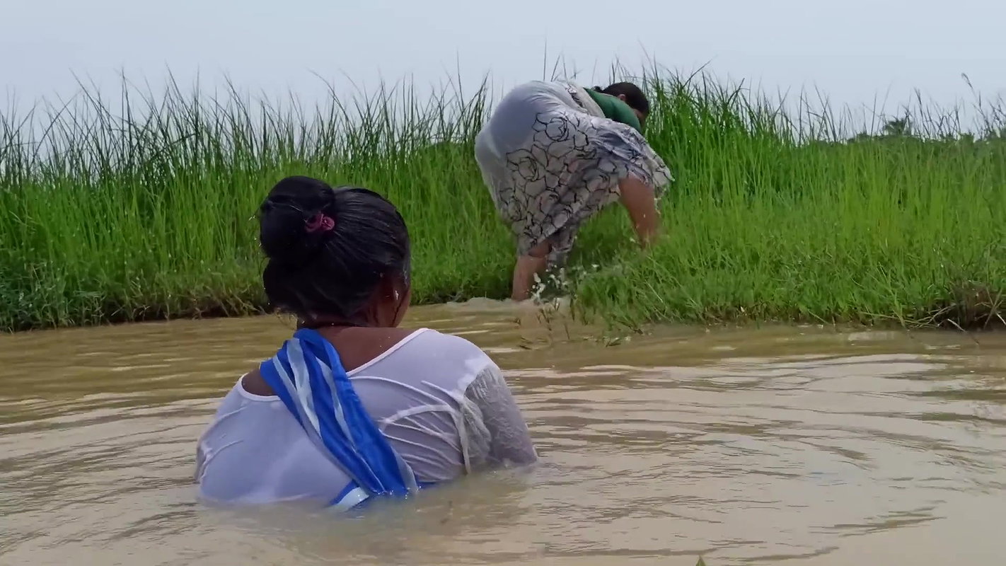 Amazing Two Village Women Catching Fish with Net