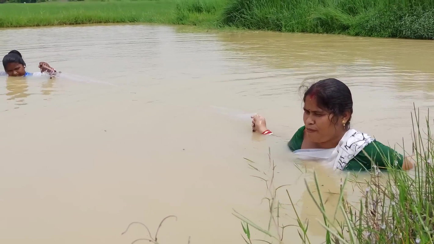 Amazing Two Village Women Catching Fish with Net