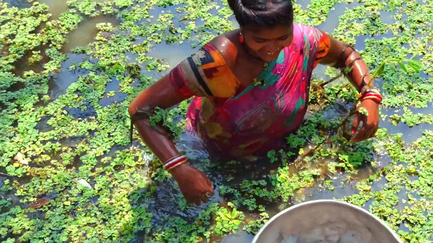 x Amazing Village Women Fishing in Dirty water