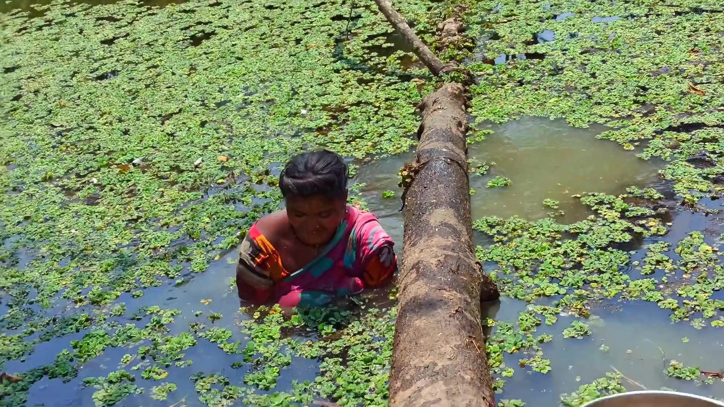 x Amazing Village Women Fishing in Dirty water