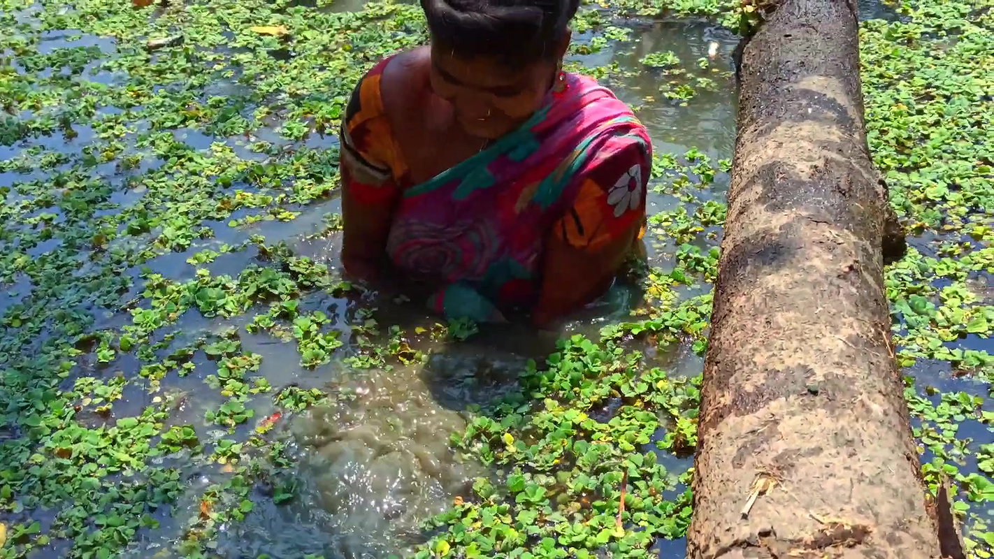 x Amazing Village Women Fishing in Dirty water