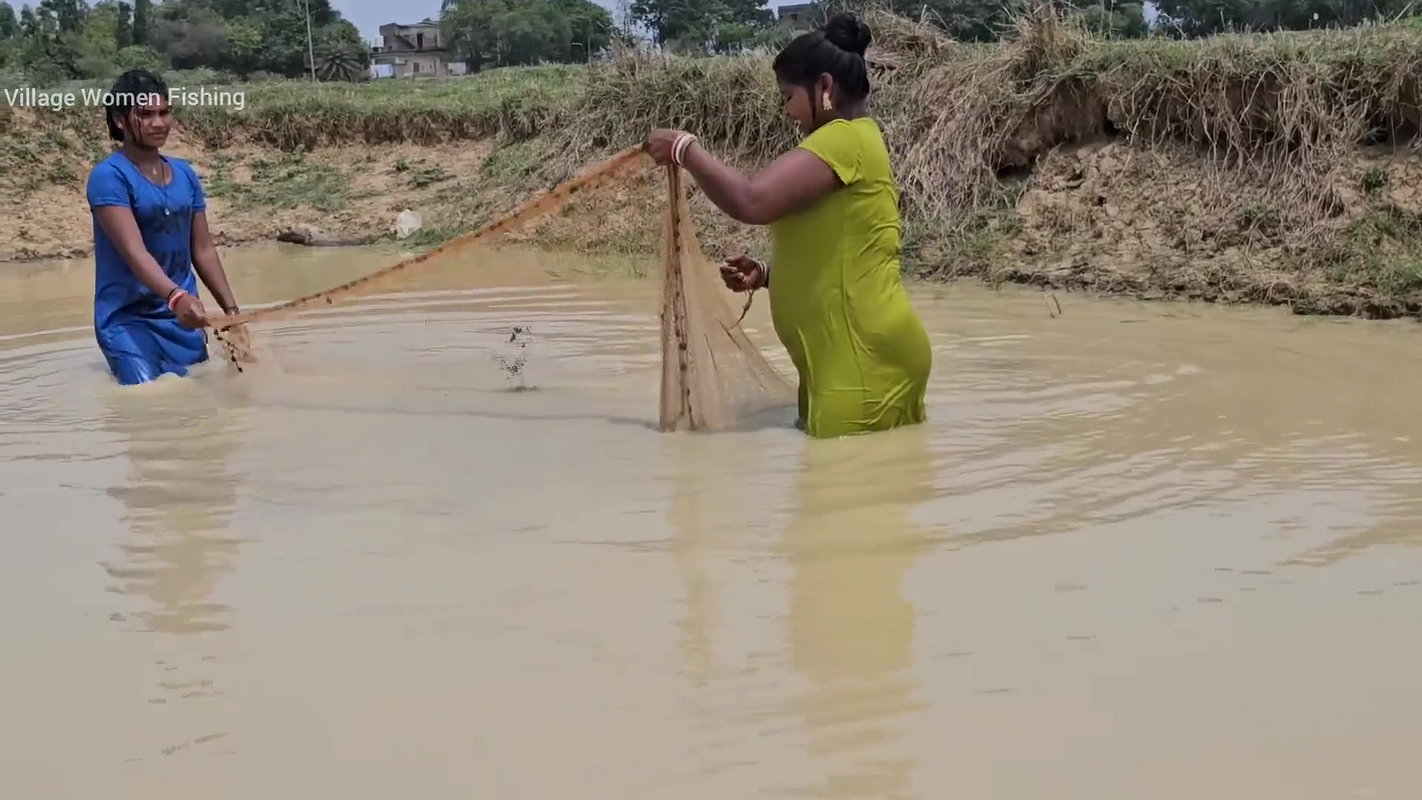 Amazing Village Women Net Fishing in Muddy Water