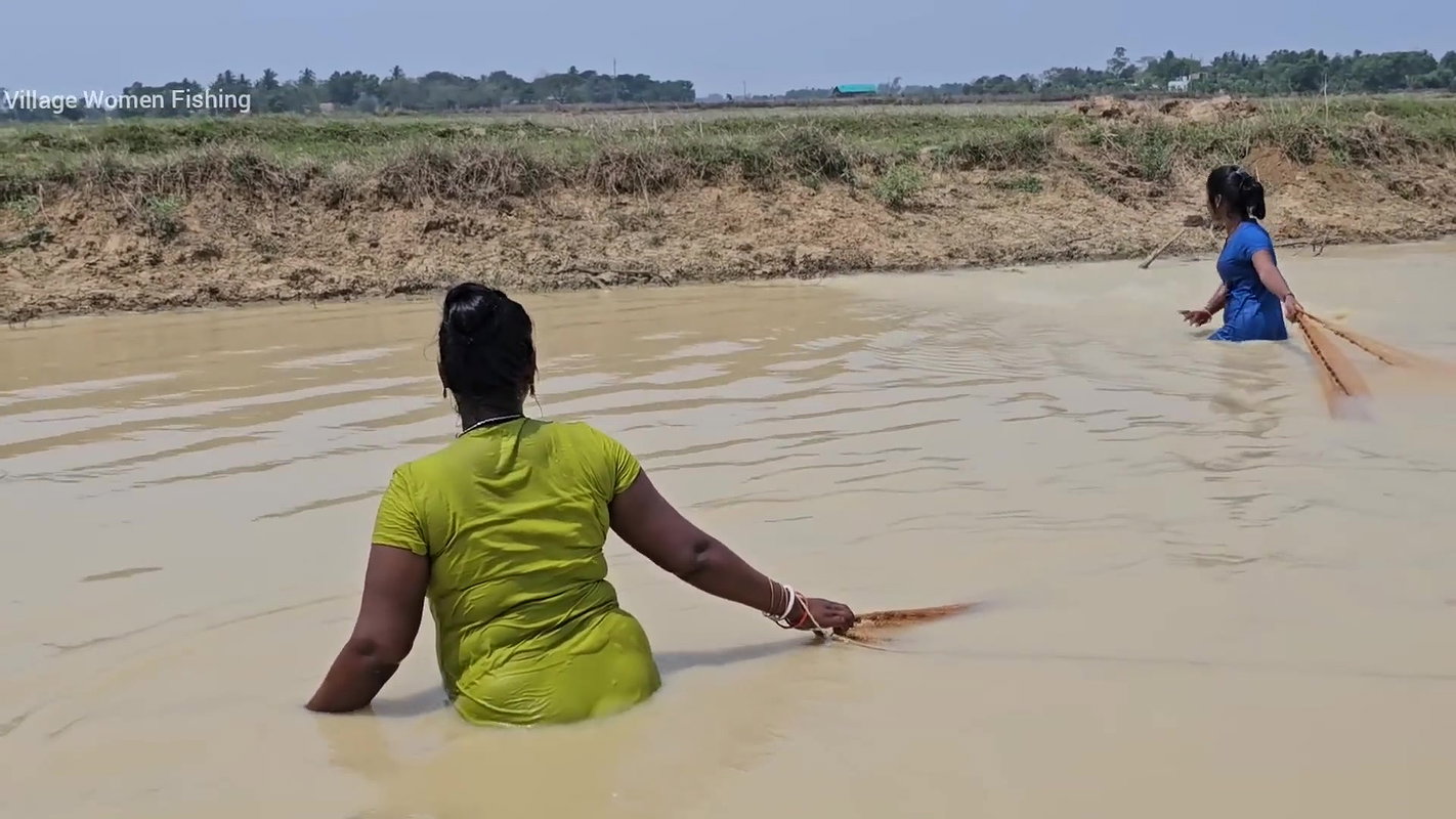 Amazing Village Women Net Fishing in Muddy Water