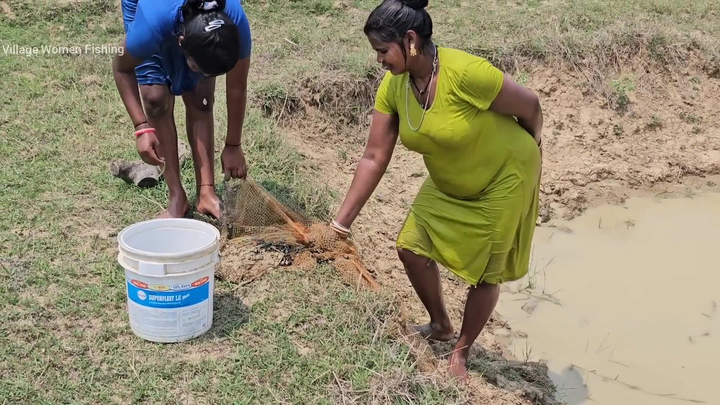 Amazing Village Women Net Fishing in Muddy Water