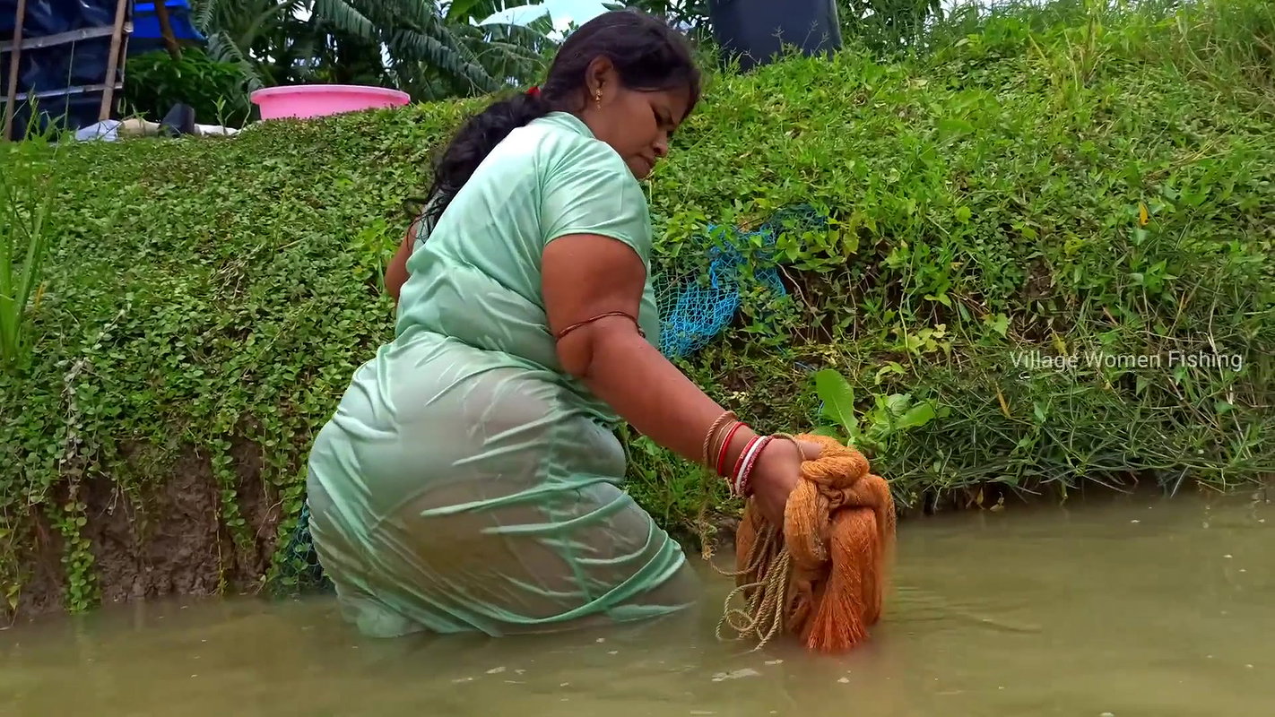 Beautiful Village Woman Net fishing in Pond    vil
