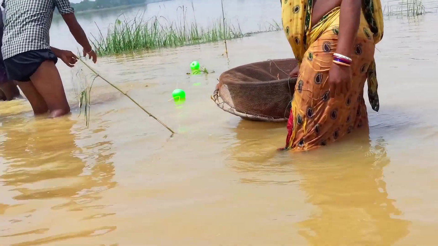 Indian Woman Goes Fishing in Flood