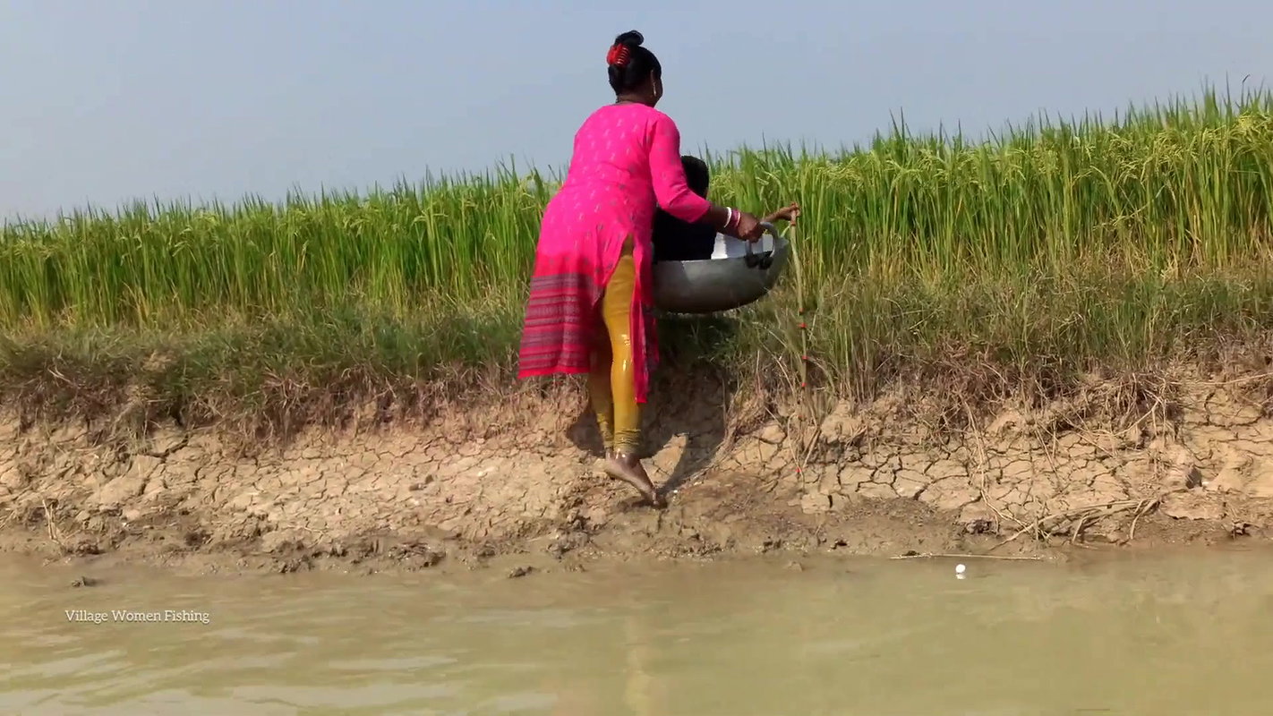 Mama Helping Her Little  Son to catch His first Fi