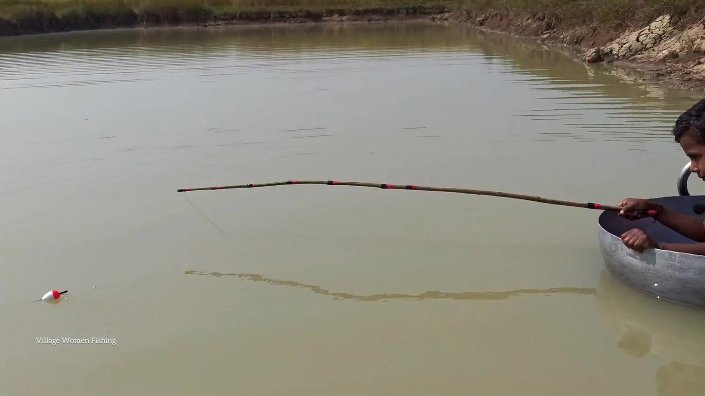 Mama Helping Her Little  Son to catch His first Fi