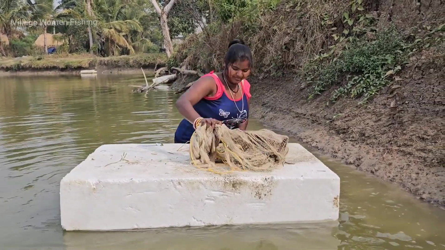 Mouni Fishing in Village pond floating on a Thermo