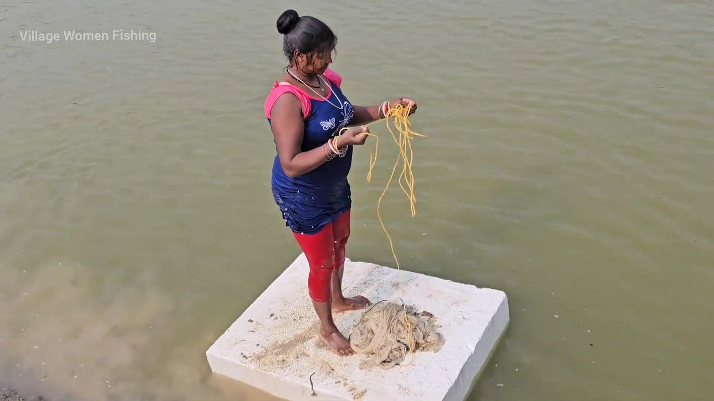 Mouni Fishing in Village pond floating on a Thermo