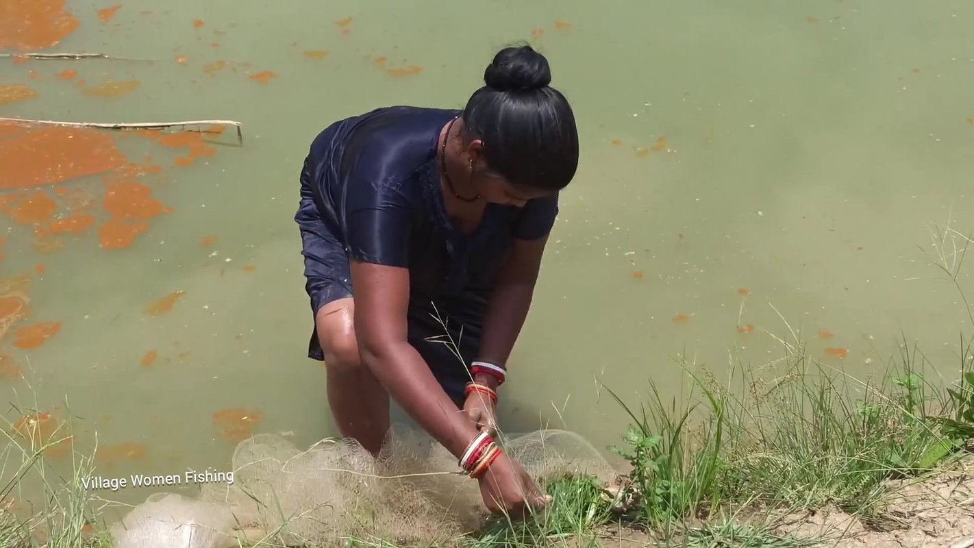 Net Fishing by Village women in village pond   Mou