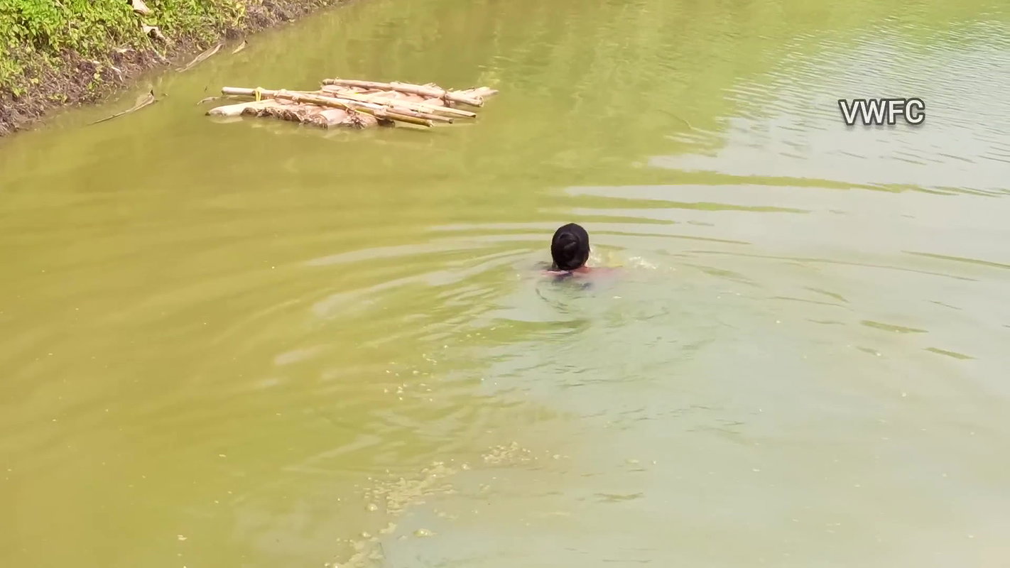 Traditional net fishing by village women   Village