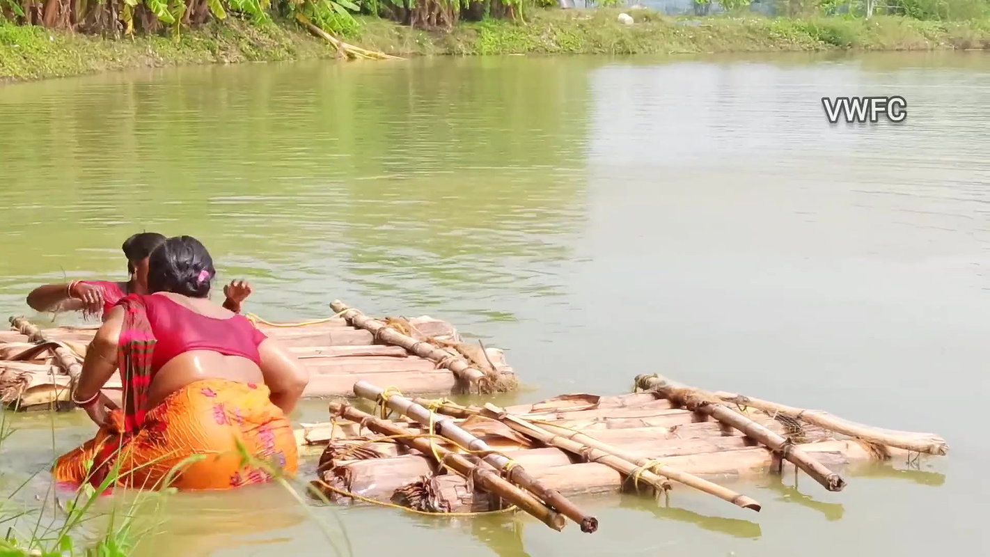 Traditional net fishing by village women   Village