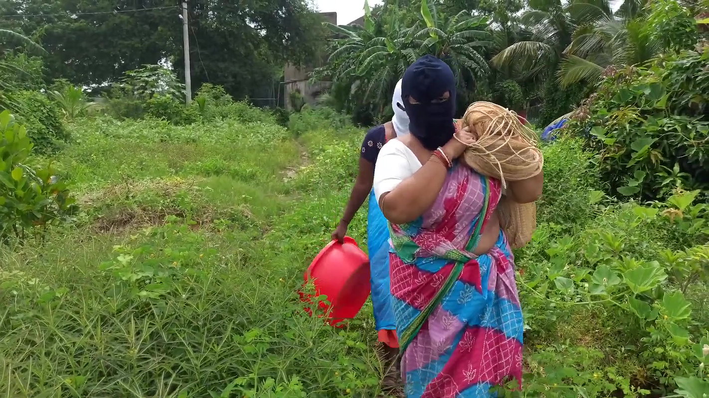 Village Masked Women Fishing in Dangerous Water