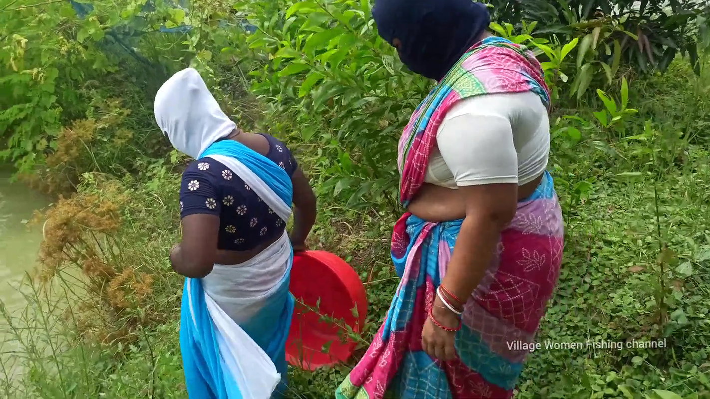 Village Masked Women Fishing in Dangerous Water