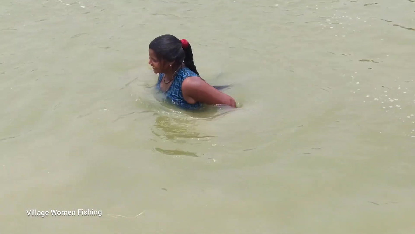 Village women net fishing in Village Pond   Lots o