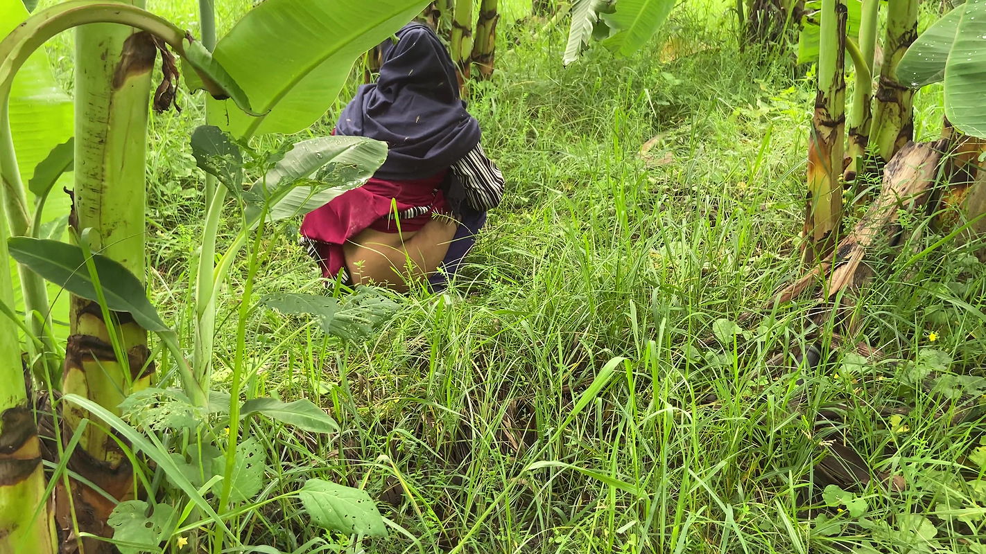 I took my neighbor into the banana plantation and hugged her and started fucking