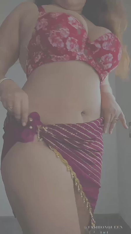 NAUGHTY BUSTY BABE IN BRA AND SARONG SEXY TEASE