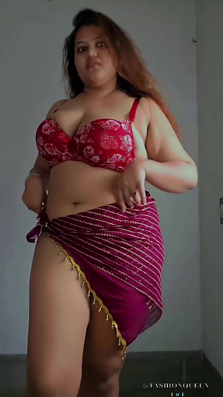 NAUGHTY BUSTY BABE IN BRA AND SARONG SEXY TEASE