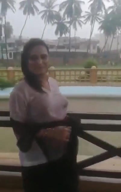Desi Bhabhi in REsort Dancing in Rain showing her boobs