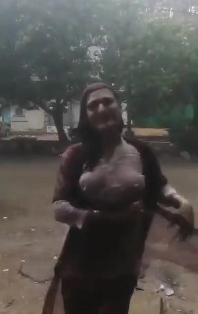 Desi Bhabhi in REsort Dancing in Rain showing her boobs