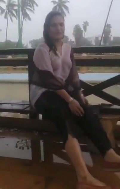 Desi Bhabhi in REsort Dancing in Rain showing her boobs