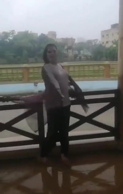 Desi Bhabhi in REsort Dancing in Rain showing her boobs