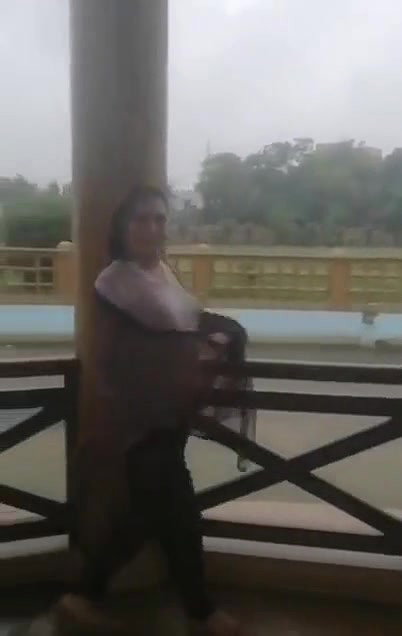 Desi Bhabhi in REsort Dancing in Rain showing her boobs
