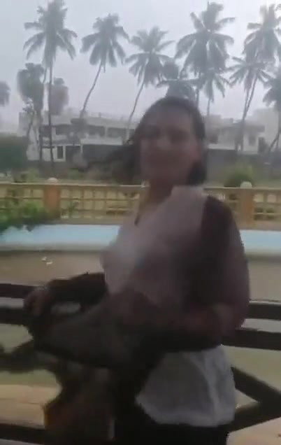 Desi Bhabhi in REsort Dancing in Rain showing her boobs