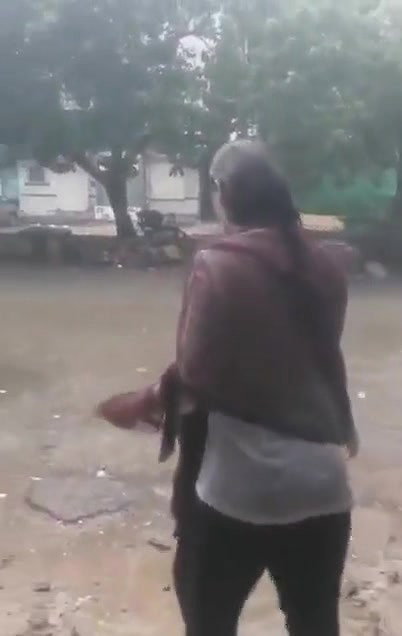 Desi Bhabhi in REsort Dancing in Rain showing her boobs