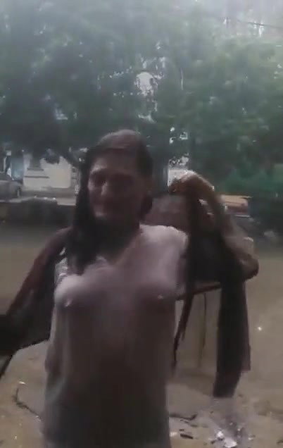 Desi Bhabhi in REsort Dancing in Rain showing her boobs