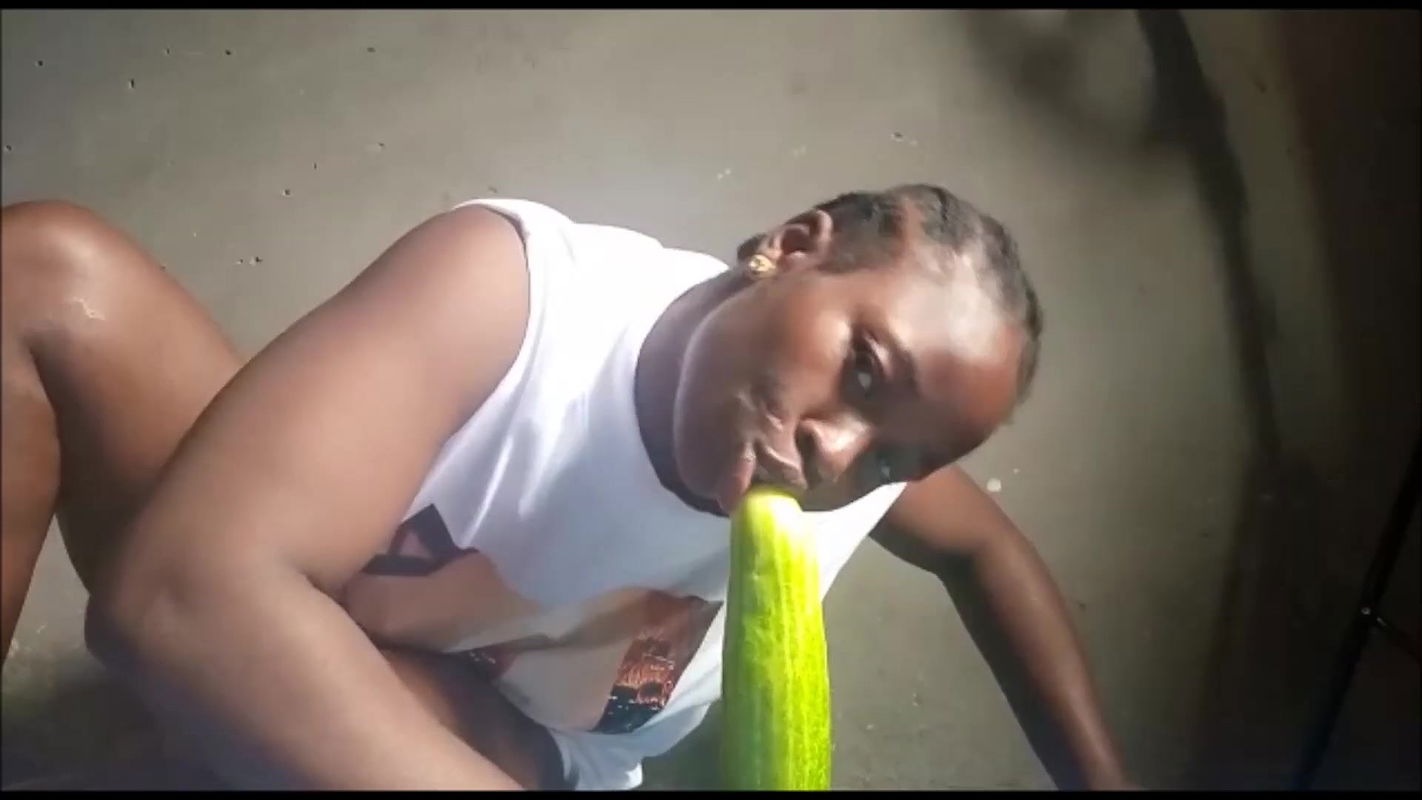 Ebony uses huge cucumber for squirting orgasm