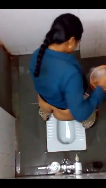 indian girl changing pad in toilet