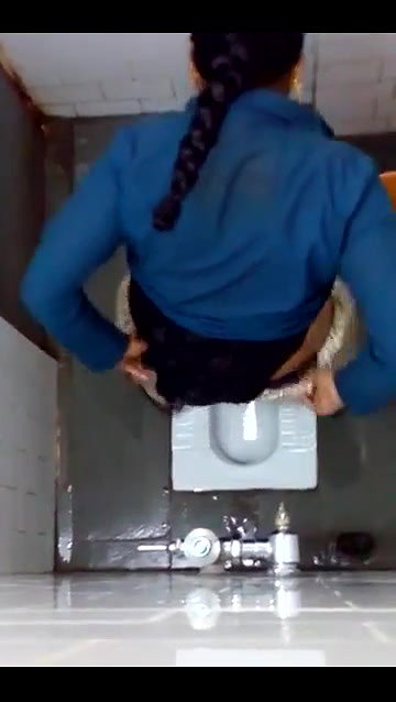 indian girl changing pad in toilet