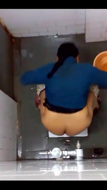 indian girl changing pad in toilet