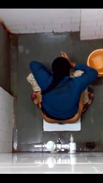 indian girl changing pad in toilet