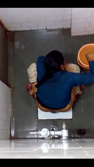 indian girl changing pad in toilet