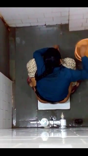 indian girl changing pad in toilet