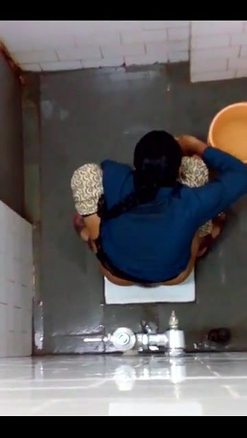 indian girl changing pad in toilet