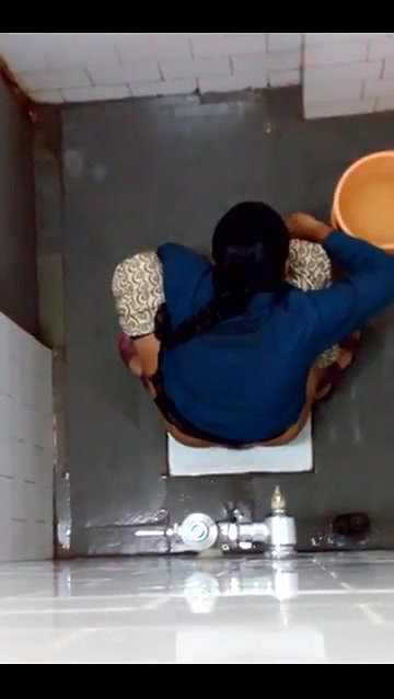 indian girl changing pad in toilet