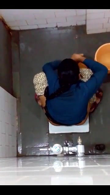 indian girl changing pad in toilet