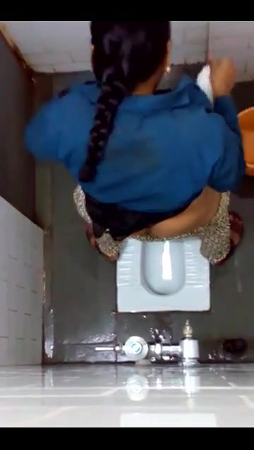 indian girl changing pad in toilet