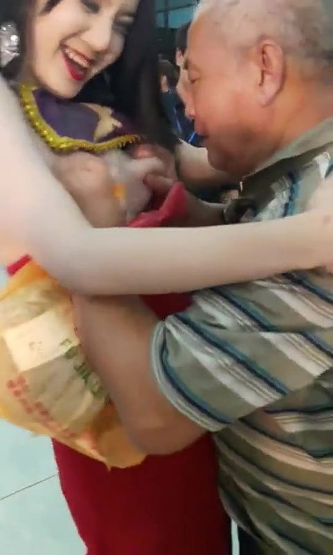 Old Man Pressing Model Boobs Openly