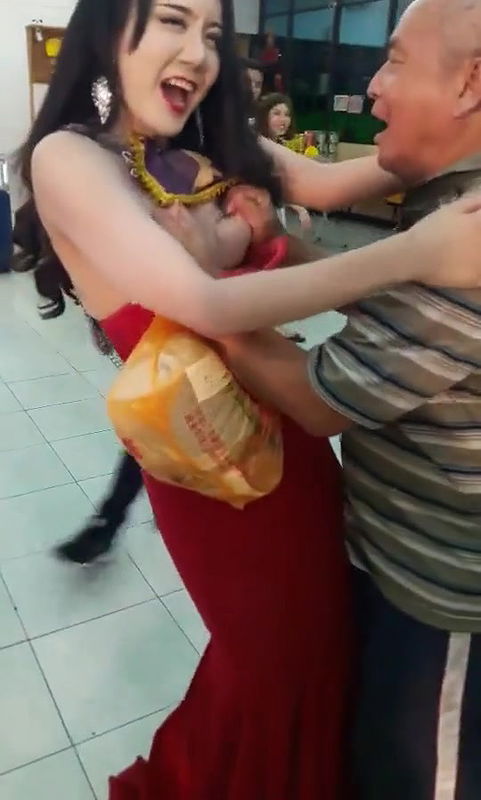 Old Man Pressing Model Boobs Openly