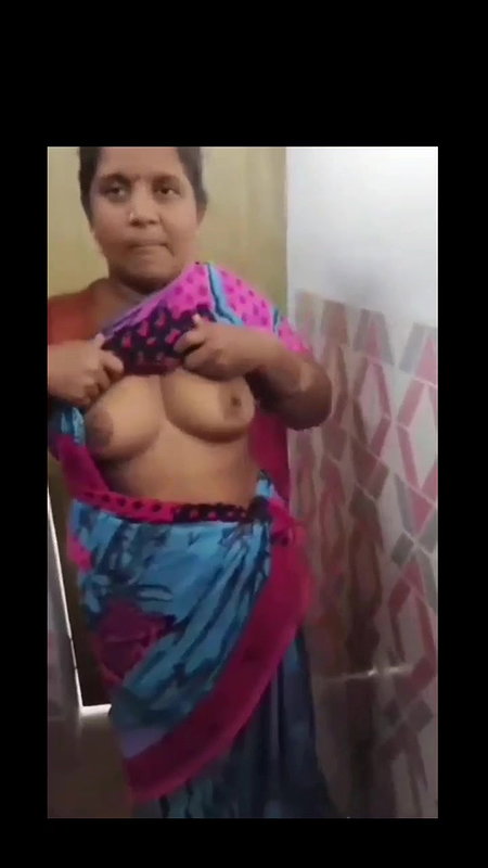 Desi Village aunty showing boobs nd sucking in bathroom