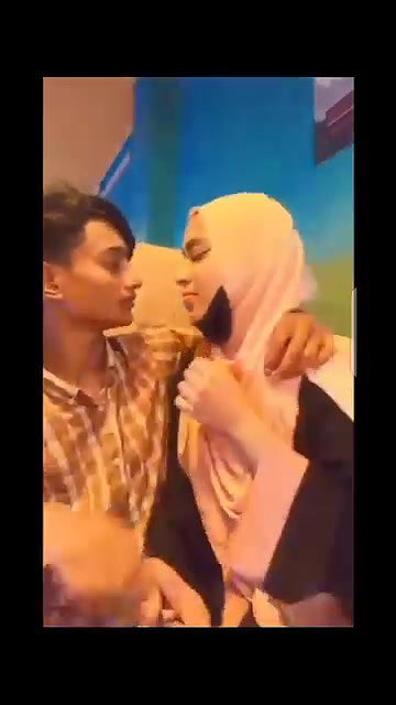Young Boy Enjoying With His Hijabi GF In Restaurant