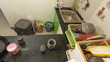 My girl friend massaging her boobs with oil in kitchen