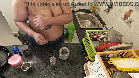 My girl friend massaging her boobs with oil in kitchen