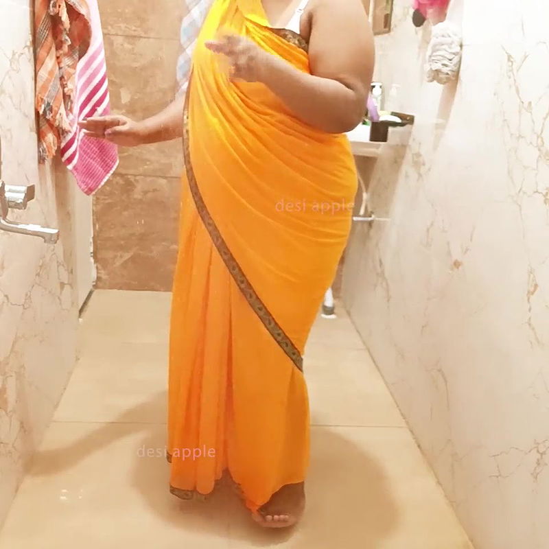 Indian maid bathing in saree